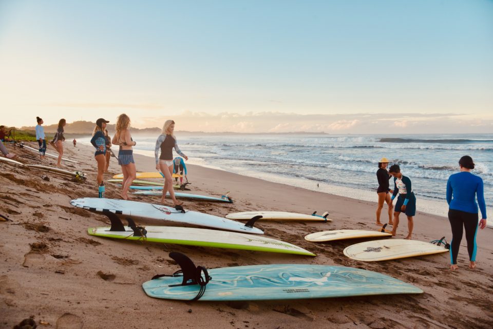 surf with amigas, playa grande, learn to surf, sunrise, beach, girls surfing