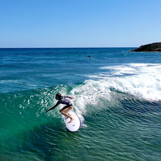 Amiga JJ Barrows surfing at a Surf with Amigas retreat